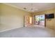 Bright bedroom with patio access, ceiling fan and carpeting at 10523 Cheval Pl, Lakewood Ranch, FL 34202