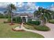 Stunning home exterior with lush landscaping and palm trees at 10523 Cheval Pl, Lakewood Ranch, FL 34202