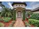 Inviting front entry with decorative columns and a brick pathway at 10523 Cheval Pl, Lakewood Ranch, FL 34202