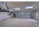 Spacious garage with epoxy flooring and ample storage at 10523 Cheval Pl, Lakewood Ranch, FL 34202