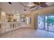 Open concept kitchen with island and views to the living and pool areas at 10523 Cheval Pl, Lakewood Ranch, FL 34202