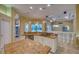 Spacious kitchen with granite countertops and island at 10523 Cheval Pl, Lakewood Ranch, FL 34202