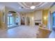 Spacious living area with high ceilings, fireplace and access to the foyer at 10523 Cheval Pl, Lakewood Ranch, FL 34202