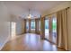 Main bedroom with hardwood floors and access to the pool area at 10523 Cheval Pl, Lakewood Ranch, FL 34202