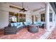 Covered patio with wicker furniture and fire pit at 10523 Cheval Pl, Lakewood Ranch, FL 34202
