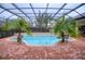 Spacious screened pool with brick decking at 10523 Cheval Pl, Lakewood Ranch, FL 34202