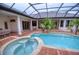 Inviting pool and spa with brick patio at 10523 Cheval Pl, Lakewood Ranch, FL 34202
