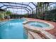 Resort-style pool and spa with lush landscaping at 10523 Cheval Pl, Lakewood Ranch, FL 34202