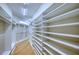 Spacious walk-in closet with custom shelving at 10523 Cheval Pl, Lakewood Ranch, FL 34202