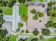 Aerial view showing home, barn, riding arena, and lush grounds at 1101 Anclote Blvd, Tarpon Springs, FL 34689