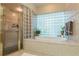 Relax in this spa-like bathroom with a soaking tub and shower at 1101 Anclote Blvd, Tarpon Springs, FL 34689