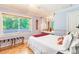 Bedroom with window, mirror, and a comfy bed at 1101 Anclote Blvd, Tarpon Springs, FL 34689