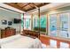 Spacious bedroom with French doors leading to the pool at 1101 Anclote Blvd, Tarpon Springs, FL 34689