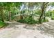 Two-story house with a covered porch and lush landscaping at 1101 Anclote Blvd, Tarpon Springs, FL 34689