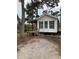 Charming single-story home with wooden deck and pond views at 1101 Anclote Blvd, Tarpon Springs, FL 34689