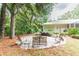Fire pit with seating area in a backyard at 1101 Anclote Blvd, Tarpon Springs, FL 34689
