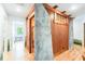 Unique hallway with wood wall and painted design at 1101 Anclote Blvd, Tarpon Springs, FL 34689