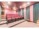 Spacious home theater with tiered seating and projector at 1101 Anclote Blvd, Tarpon Springs, FL 34689