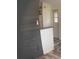 Modern kitchen with dark wood accent wall and laminate flooring at 1101 Anclote Blvd, Tarpon Springs, FL 34689