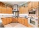 Modern kitchen with stainless steel appliances and custom wood cabinets at 1101 Anclote Blvd, Tarpon Springs, FL 34689