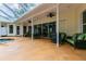 Spacious covered patio with wicker furniture and pool access at 1101 Anclote Blvd, Tarpon Springs, FL 34689