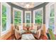 Cozy sitting area with wicker chairs and natural light at 1101 Anclote Blvd, Tarpon Springs, FL 34689