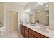 Double vanity bathroom with granite countertop at 1110 Beachcomber Ct # 1, Osprey, FL 34229