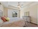 King-size bed and sliding doors leading outside at 1110 Beachcomber Ct # 1, Osprey, FL 34229