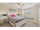 Bedroom with window seat and ceiling fan at 1110 Beachcomber Ct # 1, Osprey, FL 34229