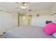 Bright bedroom with ceiling fan and built-in shelving at 1110 Beachcomber Ct # 1, Osprey, FL 34229