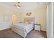 King-size bed, dresser, and ensuite bathroom access at 1110 Beachcomber Ct # 1, Osprey, FL 34229