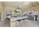 Outdoor kitchen with grill and bar seating at 1110 Beachcomber Ct # 1, Osprey, FL 34229