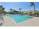 Inviting community pool with surrounding patio at 1110 Beachcomber Ct # 1, Osprey, FL 34229
