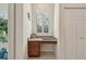 Built-in home office features a granite countertop and wood cabinets at 1110 Beachcomber Ct # 1, Osprey, FL 34229