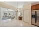 Kitchen with breakfast bar and view of the sunroom at 1110 Beachcomber Ct # 1, Osprey, FL 34229
