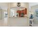 Kitchen boasts a breakfast bar and views into the sunroom at 1110 Beachcomber Ct # 1, Osprey, FL 34229