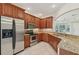 Modern kitchen with stainless steel appliances and granite countertops at 1110 Beachcomber Ct # 1, Osprey, FL 34229