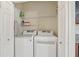 Laundry closet with washer and dryer, shelving at 1110 Beachcomber Ct # 1, Osprey, FL 34229