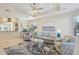 Spacious living room with coastal decor and large windows at 1110 Beachcomber Ct # 1, Osprey, FL 34229