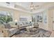 Bright living room with bay window, comfy seating, and coastal decor at 1110 Beachcomber Ct # 1, Osprey, FL 34229