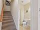 Carpeted staircase leading to upper level at 1110 Beachcomber Ct # 1, Osprey, FL 34229