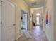 Bright and spacious entryway with tile flooring and access to other rooms at 11698 Anhinga Ave, Venice, FL 34292