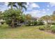 Landscaped backyard with lush greenery and privacy at 11921 Whistling Way, Lakewood Ranch, FL 34202