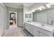 Bathroom with double sinks, and access to another bedroom at 11921 Whistling Way, Lakewood Ranch, FL 34202
