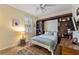 Bedroom with built-in shelves and a Murphy bed at 11921 Whistling Way, Lakewood Ranch, FL 34202
