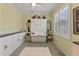 Guest bedroom with a Murphy bed, built-in cabinets, and wood floors at 11921 Whistling Way, Lakewood Ranch, FL 34202
