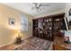 Bedroom with built-in shelves and a Murphy bed at 11921 Whistling Way, Lakewood Ranch, FL 34202
