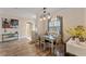 Charming dining room with hardwood floors and a farmhouse table at 11921 Whistling Way, Lakewood Ranch, FL 34202