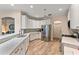 Modern kitchen featuring white cabinets and stainless steel appliances at 11921 Whistling Way, Lakewood Ranch, FL 34202