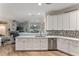 Eat-in kitchen with granite countertops and stainless steel appliances at 11921 Whistling Way, Lakewood Ranch, FL 34202